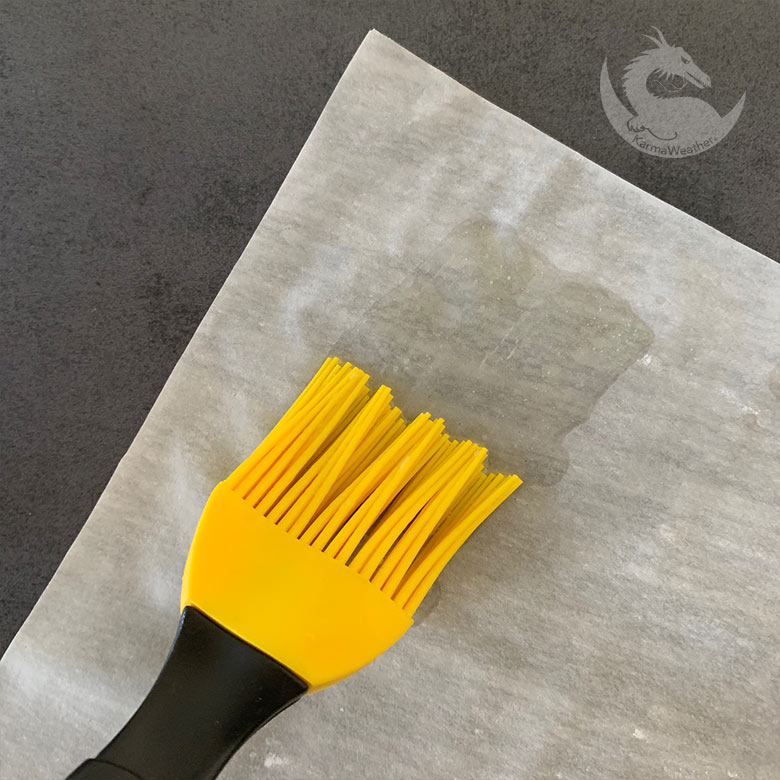 Butter spread on phyllo dough using a cooking brush